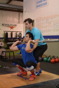 how to teach the clean partner squat stretch